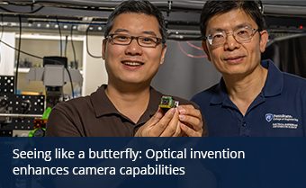 two individuals pose in a lab holding a small device known as a metasurface